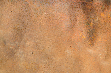 The texture of a rusty metal sheet of iron in sunlight