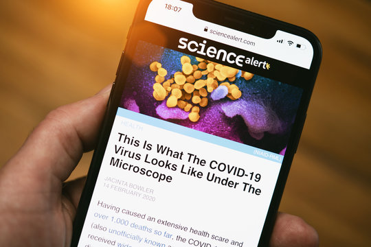 Apple Iphone Screen With Content Of Science Alert Website Showing An Electron Micrograph Of Coronavirus Of The Corona Covid-19 Virus