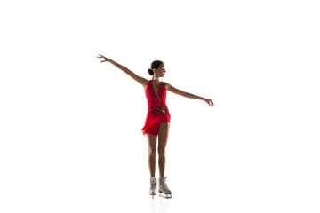 Girl figure skating isolated on white studio backgound with copyspace. Professional practicing and training in action and motion on ice. Graceful and weightless. Concept of movement, sport, beauty.