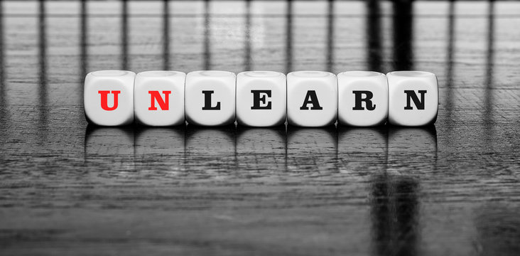 Banner with word learn or unlearn - dilema concept