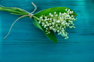 Lily of the Valley on wooden background