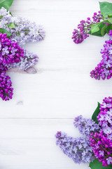 The beautiful lilac on a wooden background