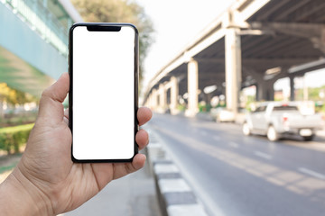 Asian man holding phone mock up left frame show application transportation take to destination isolated display for insert screen