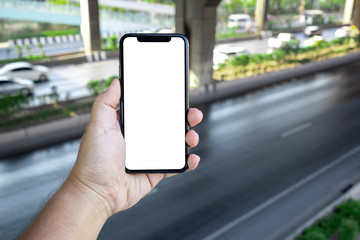 Asian man holding phone mock up center frame wait take photo car on the overpass isolated display for insert screen