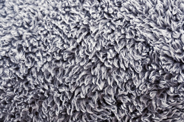 Grey fluffy polyester texture soft focus background
