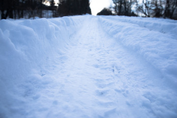 Fototapeta na wymiar snowy road in forest
