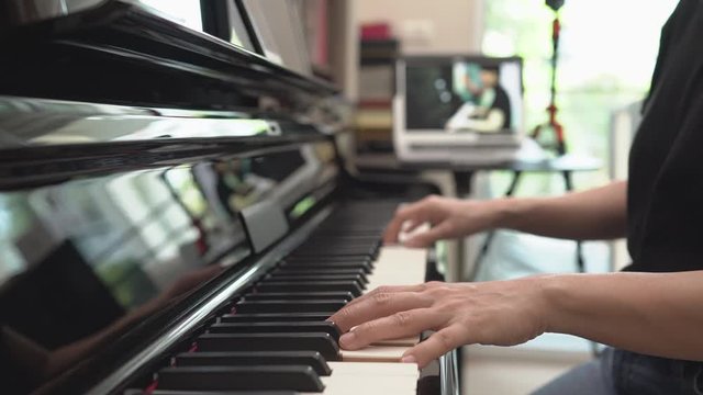 Homeschooling piano lessons online training or E-class learning while Coronavirus spread out or covid-19 crisis situation, Online piano lesson to teach students pupils learn from home.