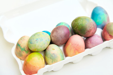 Easter painted eggs folded in plastic container