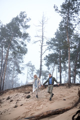 Winter picnic in forest. Love story on winter foggy sand beach. valentines concept. cloudy foggy day in forest and beach