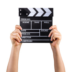 Obraz premium Human hand holding film clapper board isolated on white background with clipping path