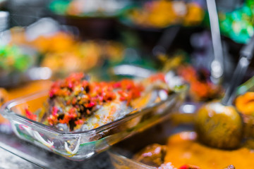 Traditional Asian dishes sold in a food court in Singapore