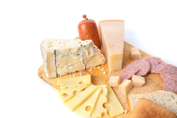 Flat lay composition with board of delicious cheese and snacks on white background