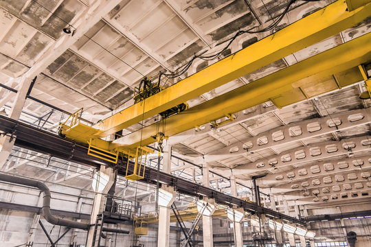 Overhead crane at an industrial plant, background production, construction site