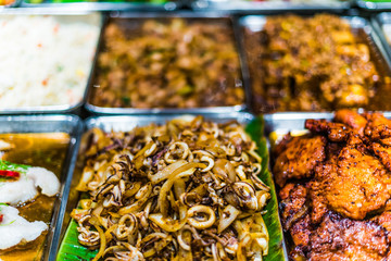 Traditional Asian dishes sold in a food court in Singapore