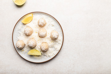 Homemade Raw Vegan Coconut and Lemon Truffles on White Background