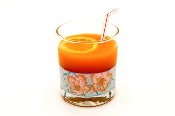 Multifruit juice in a glass with a straw