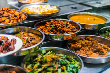 Traditional Asian dishes sold in a food court in Singapore