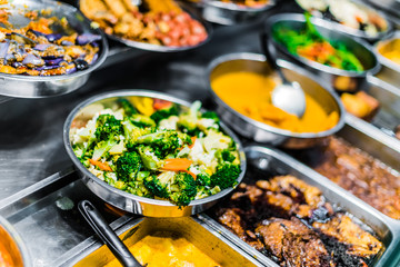 Traditional Asian dishes sold in a food court in Singapore