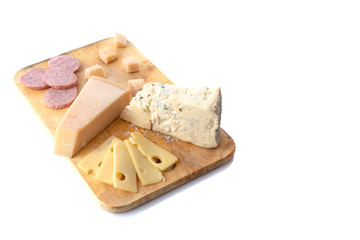 Portion of cheese and sausages on rustic wooden board isolated over white background