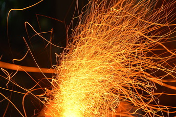 Sparks from stove charcoal. Long exposure. 