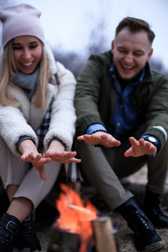Winter picnic on baech with bonfire. Love story on winter foggy sand beach. valentines concept.