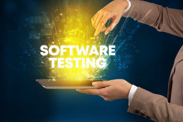 Close-up of a touchscreen with SOFTWARE TESTING inscription, innovative technology concept