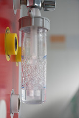 Medical oxygen flow meter with humidification bottle. Oxygen therapy is used in patient with pneumonia caused by coronavirus covid-19.