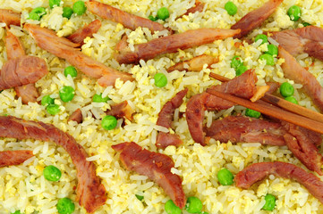 Egg fried rice with peas and pork strips background