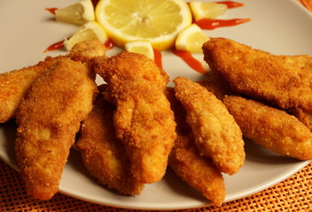 Crunchy fried chicken breast pieces on the plate