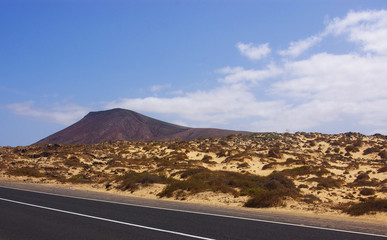 Dunes and volcanic nature road