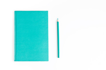 Notebook daily planner and pencil same turquoise color on a white background