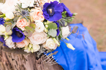 Wedding flowerst on a wood. Bridal bouquet outdoor. copy space for chic boho wedding magazines and websites, bohemian, fashion, florist and other related subjects
