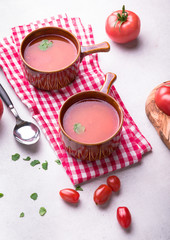 Delicious tomato soup on a light background.