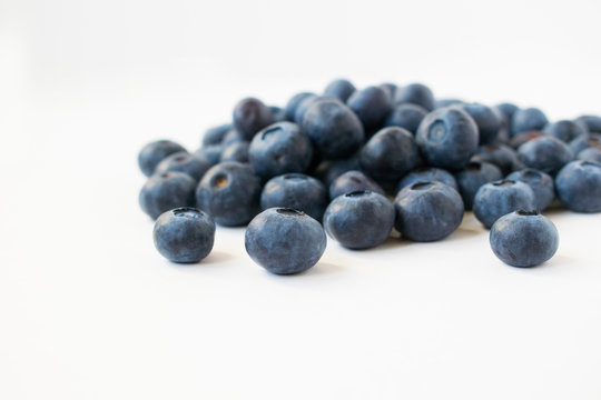 A Handful Of Blueberries. Isolated On Grey Background.