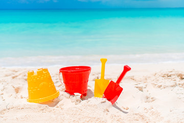 Beach kid's toys on white sand beach
