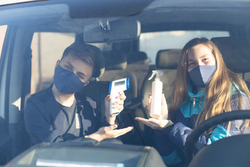  People gets body temperature measured with an infrared non-contact thermometer. Non-contact...
