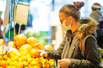Caucasian woman shopping wearing mask