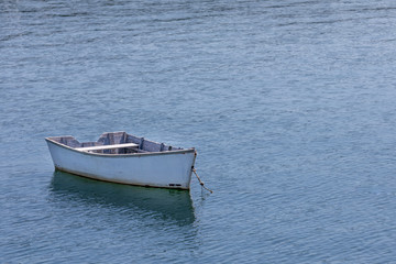 White Row Boat Moored in Bay
