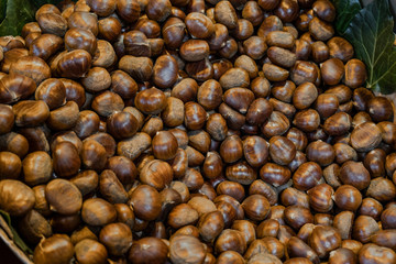 Raw chestnuts for sale in market. Delicious and healthy snacks.
