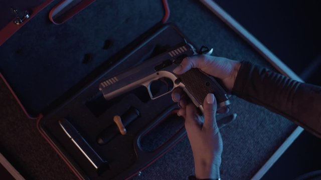 open the case with the weapon and take the gun