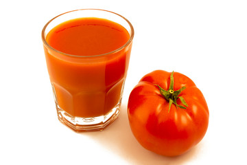 Tomato and a glass of tomato juice.