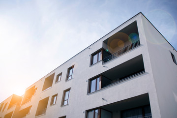 Modern apartment building flat estate concept. Outdoor residential facility at sunset and sunrise.