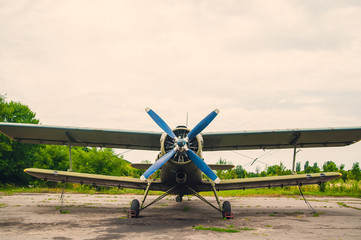 Old green plane in the parking lot
