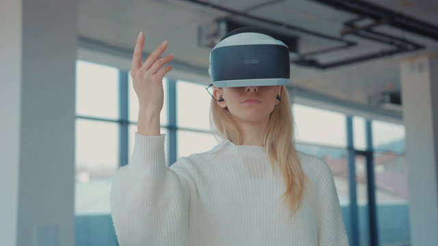 Augmented Reality. Close-up of a Female Doctor Looking: Medical Charts, 3D Hologram (DNA hologram, Pulmonary System, Muscular System, COVID-19) Wearing VR Glasses and Headsets. Future Medicine. VR