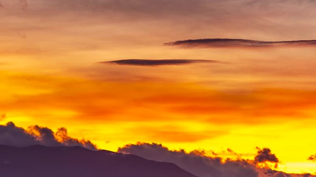 Vivid clouds moving rapidly, golden sunset time lapse, background video FULL HD