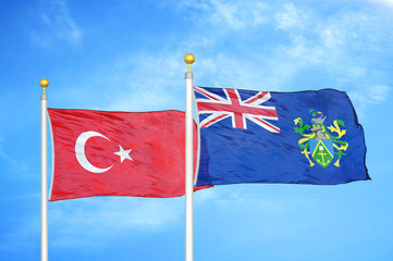 Turkey and Pitcairn Islands two flags on flagpoles and blue cloudy sky