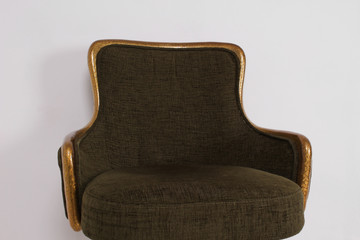 green bar stool with soft upholstery and gold legs on a white background