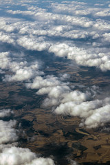 View of the clouds from the plane. Smooth bands of clouds. patterns from clouds. small clouds.