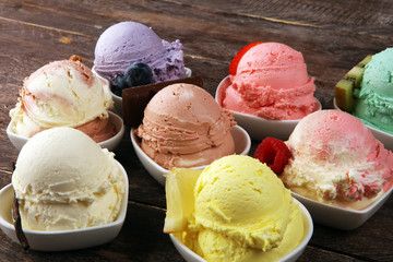 Various of ice cream flavor whit fresh blueberry, strawberry, kiwi, lemon, vanilla setup on rustic...