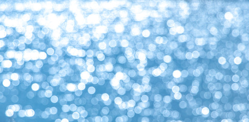 Abstract light blue background with white bokeh_